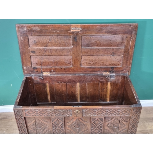 8 - A 17th Century joined oak Coffer with sunken four panel lid above lozenge carved three panel front 3... 