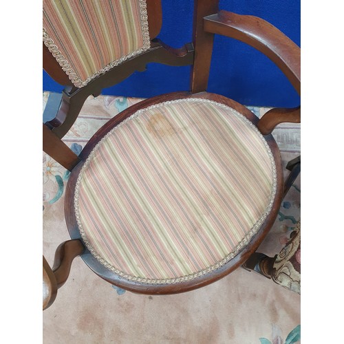 696 - A ladder back Single Chair with floral upholstered seat,  and an Edwardian striped upholstered Elbow... 