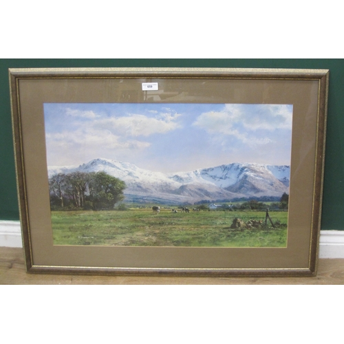 659 - AFTER P. STANTON.  A framed colour print of a rural landscape with cattle and snow covered mountains... 