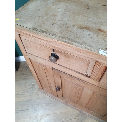 579 - A pine Cupboard fitted two drawers above central solid panelled door, 3ft 5in wide, 3ft 1in high,