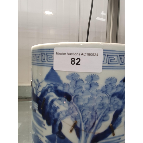 82 - A Chinese blue and white Brush Pot painted landscape, 6in, A/F, and a wooden Brush Pot, 5 1/2in (R1)