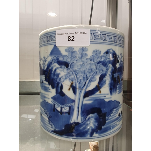 82 - A Chinese blue and white Brush Pot painted landscape, 6in, A/F, and a wooden Brush Pot, 5 1/2in (R1)