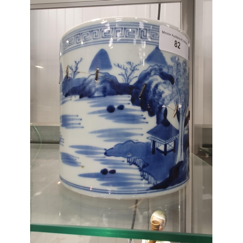 82 - A Chinese blue and white Brush Pot painted landscape, 6in, A/F, and a wooden Brush Pot, 5 1/2in (R1)