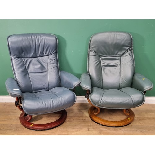 15 - A near pair of leather effect swivel Armchairs 3ft 2in H x 2ft 6in W (R2)