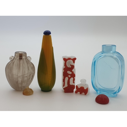 219 - A glass Snuff Bottle formed as corn on the cob, a pale blue glass Snuff Bottle and two others