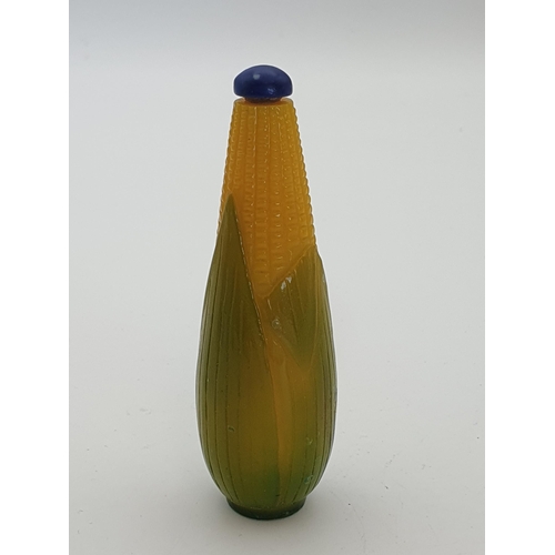 219 - A glass Snuff Bottle formed as corn on the cob, a pale blue glass Snuff Bottle and two others