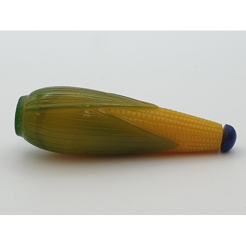 219 - A glass Snuff Bottle formed as corn on the cob, a pale blue glass Snuff Bottle and two others