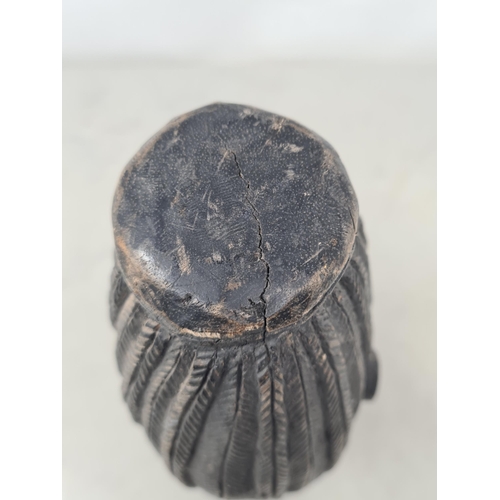 442 - An East African carved Head of a male tribesman with plaited hair 10 3/4in H (R2)