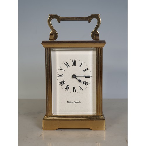 75 - A brass cased Carriage Clock by Mappin & Webb with applied brass inscription plate to the back, 4 1/... 