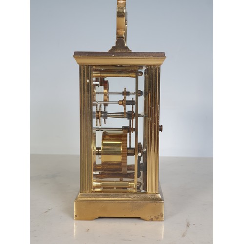 75 - A brass cased Carriage Clock by Mappin & Webb with applied brass inscription plate to the back, 4 1/... 