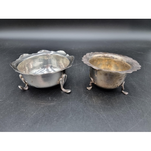 104 - Two George V silver shaped  circular Sugar Bowls on scroll feet, Birmingham 1914 & London 1916