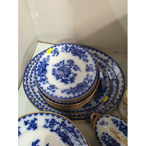 129 - A Floe-Blue part Dinner Service including a large quantity of Dinner Plates, Side Plates, oval Meat ... 