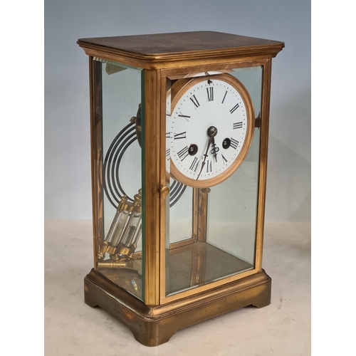 146 - A brass and glass cased Mantel Clock with mercury pendulum and striking on a gong, and an oak cased ... 