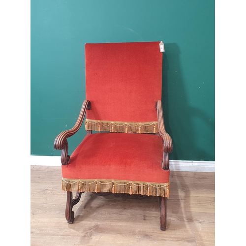 147 - A 19th Century mahogany and upholstered Armchair with scrolled arms, supports and stretchers (R10)