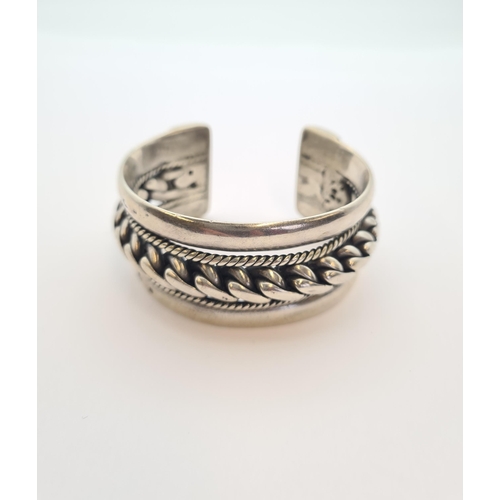 163 - An Egyptian silver rigid rope twist Bangle, approx 130gms