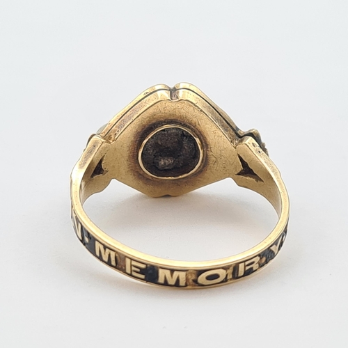 175 - A Victorian Mourning Ring set agate with carved cross and pearls, inscribed 'In Memory Of' in 18ct g... 