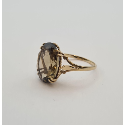 179 - A Smoky Quartz Dress Ring in 9ct gold, ring size O 1/2, approx 3.20gms