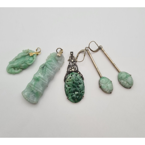 191 - Three carved Jade Pendants on silver and silver gilt mounts, a pairs of Ear Pendants set oval carved... 