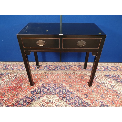 2 - A Chinese black lacquered Side Table fitted two frieze drawers on square supports 3ft 2in W x 2ft 10... 