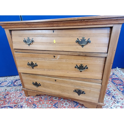 22 - An Edwardian satin walnut Chest of three long drawers 3ft W x 2ft 8in H and an oak Student's Bureau ... 