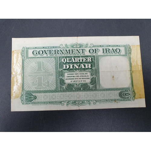 232 - An Iraq 1931 (ND 1942) Quarter Dinar Note, old mount marks to reverse