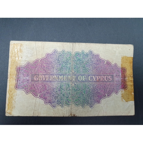 236 - A George VI Cyprus 1941 Two Shillings Note, 1943 3 Piastres Note, Malta Two Shillings Note and a qua... 