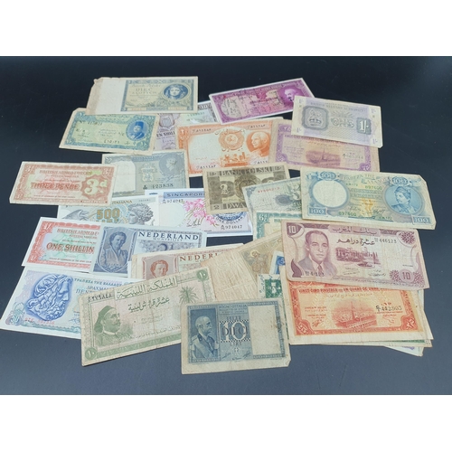 237 - A Collection of British and World Banknotes including issues from Iran, Zambia, Turkey, South Africa... 