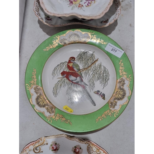 277 - A set of three pottery Plates, decorated various birds with green and gilded borders, a selection of... 