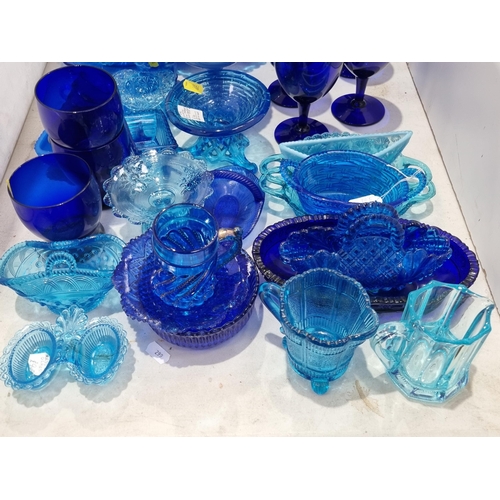 278 - A quantity of blue pressed and moulded Glass including baskets, bowls, etc, two pieces of blue glass... 