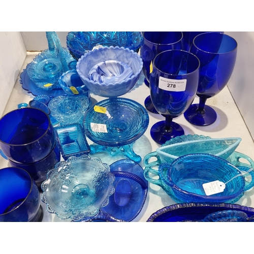 278 - A quantity of blue pressed and moulded Glass including baskets, bowls, etc, two pieces of blue glass... 