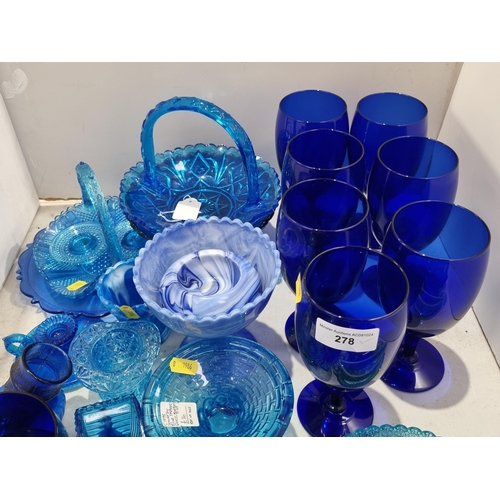 278 - A quantity of blue pressed and moulded Glass including baskets, bowls, etc, two pieces of blue glass... 