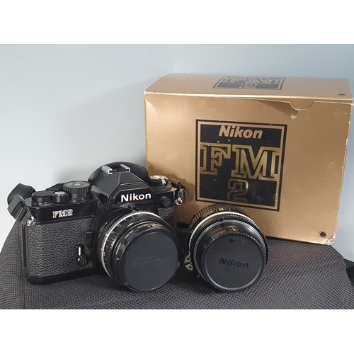 302 - A Nikon FM2 Camera, with Lens, Flashgun, and Filters, contained in Senator Cobra Carrying Case.