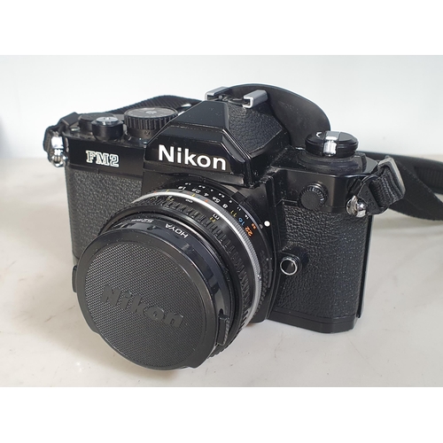 302 - A Nikon FM2 Camera, with Lens, Flashgun, and Filters, contained in Senator Cobra Carrying Case.