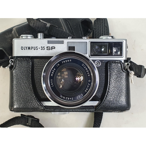 303 - An Olympus - 35 SP Camera No - 187174 in fitted black leather case.