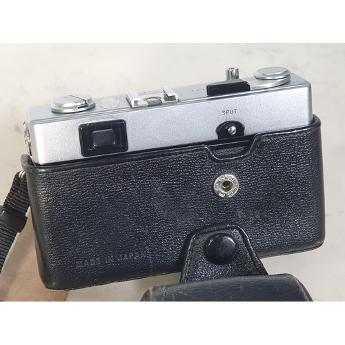 303 - An Olympus - 35 SP Camera No - 187174 in fitted black leather case.