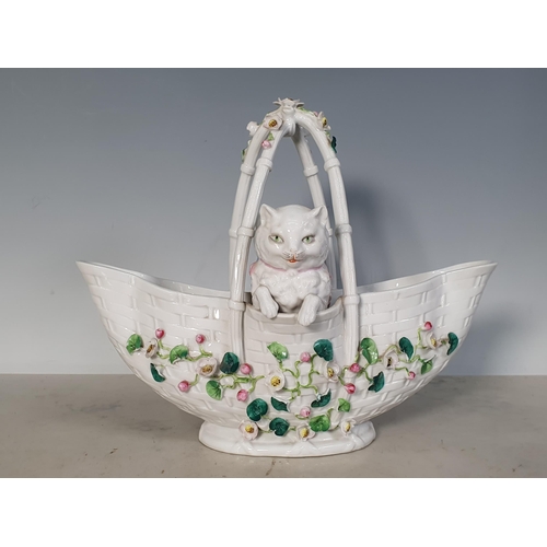 308 - A Continental porcelain Basket mounted with two cats and floral encrusted, 9in H (R1)