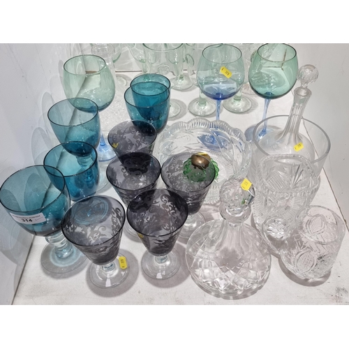 314 - A quantity of glassware including three Decanters, Wine Glasses with coloured bowls, Vases and Bowls... 