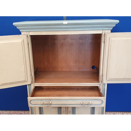 32 - A Continental blue and cream painted Cupboard fitted two pairs of doors and a central drawer 5ft 1in... 