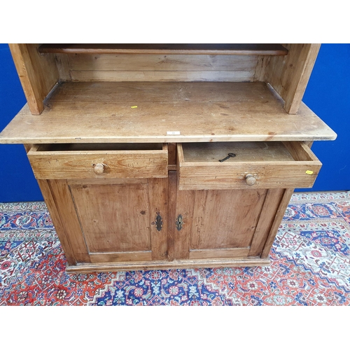 33 - A Victorian pine Bookcase with upper section fitted pair of glazed doors above base fitted single fr... 