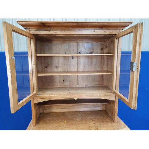 33 - A Victorian pine Bookcase with upper section fitted pair of glazed doors above base fitted single fr... 