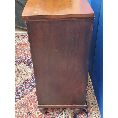 34 - A Victorian mahogany bow fronted Chest of two short and three long drawers on turned supports 3ft 6i... 