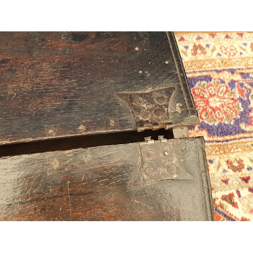 4 - A 17th Century oak Book Box with sloping lid and nulled carved front 2ft 6in W x 1ft H, lid is loose... 