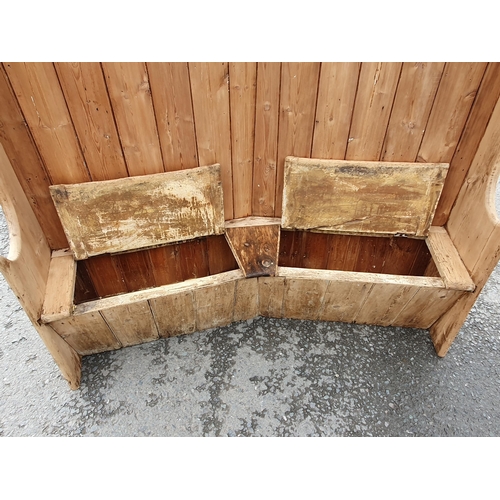 425 - A 19th Century pine curved Settle with box base fitted two hinged lids 5ft 10in H x 5ft 5in W (R1)