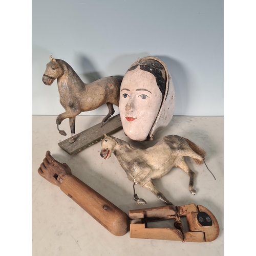 44 - Two Folk Art type toy Horses, a wooden Arm and a papier machier Head, all A/F (R7)