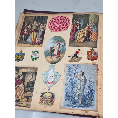 445 - A Victorian Scrap Album containing an extensive collection of cards and pictures A/F (Cab)