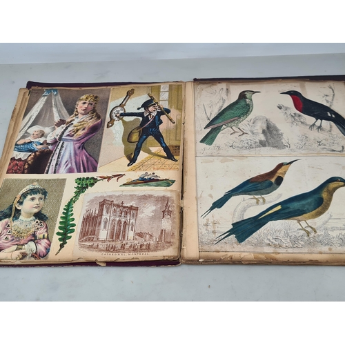 445 - A Victorian Scrap Album containing an extensive collection of cards and pictures A/F (Cab)