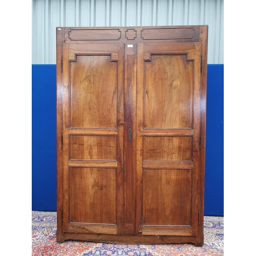 6 - An antique fruitwood two door Armoire 6ft 6in H x 4ft 4in W (R3)