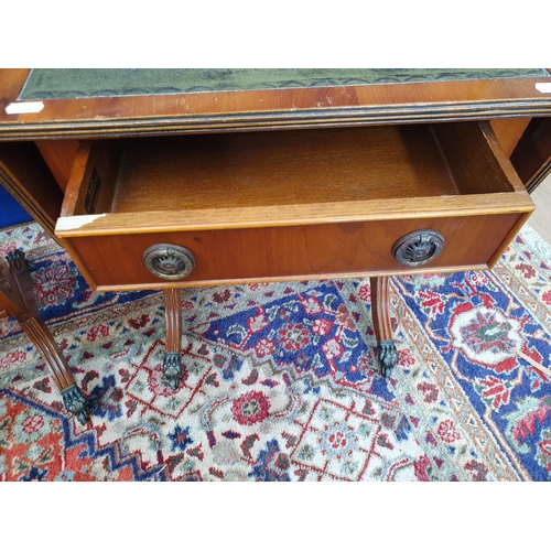 9 - A pair of reproduction yew Dropleaf Sofa Tables with inset leather type surfaces above single fitted... 