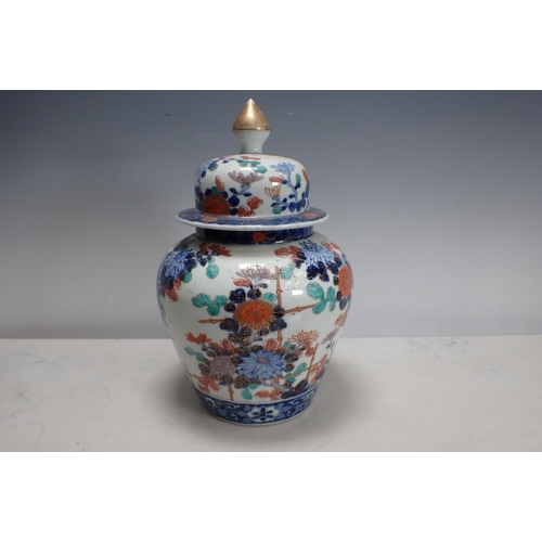 873 - An Oriental lidded Vase with orange, blue and gilt Imari style decoration to body, domed lid with kn... 