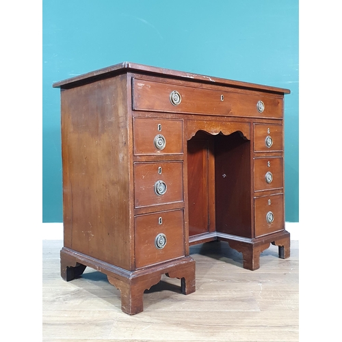 431 - A 19th Century mahogany Kneehole Desk fitted long drawer above recessed cupboard door and three draw... 